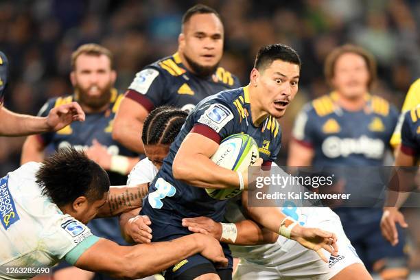 Patelesio Tomkinson of the Highlanders makes a break during the round 8 Super Rugby Aotearoa match between the Highlanders and the Blues at Forsyth...