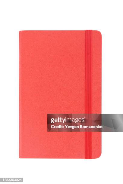 red note pad with rubber band isolated on white background - cuaderno fotografías e imágenes de stock