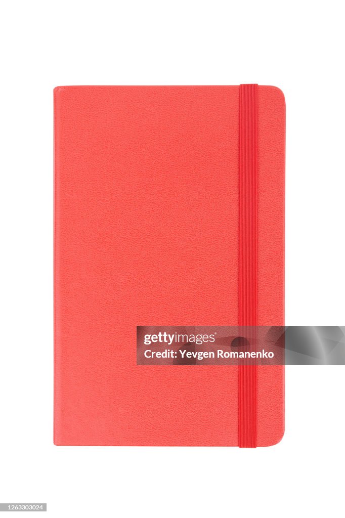 Red note pad with rubber band isolated on white background