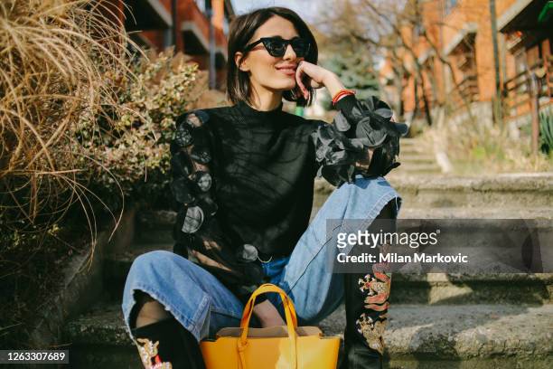 young woman's fashion style - young pretty fashioned girl - street style stock pictures, royalty-free photos & images
