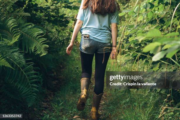 young girl walking in nature - pocket stock-fotos und bilder