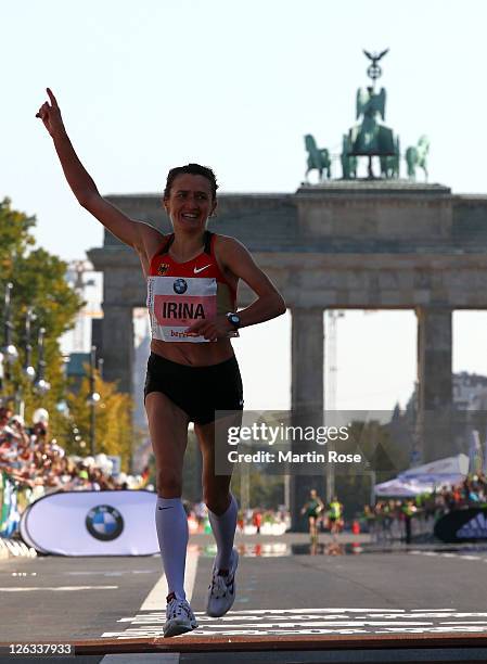 Irina Mikitenko of Germany celebrates during the BMW Berlin Marathon on September 25, 2011 in Berlin, Germany.