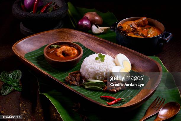 malaysian famous food nasi lemak - traditional malay food stock pictures, royalty-free photos & images