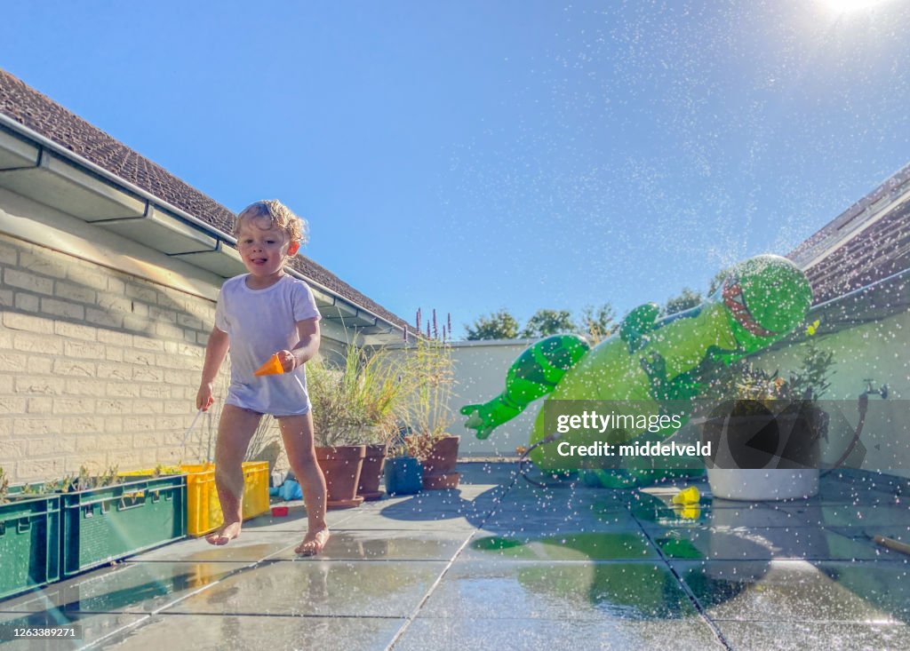 Toddler boy having  Water fun