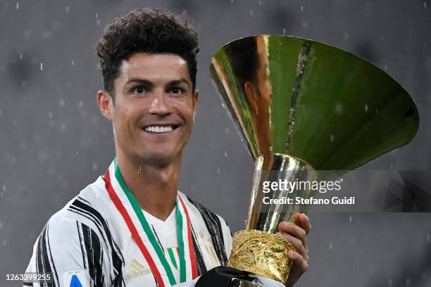 Cristiano Ronaldo of Juventus FC celebrates with the trophy after winning the Serie A Championship 2019-2020 during the Serie A match between...