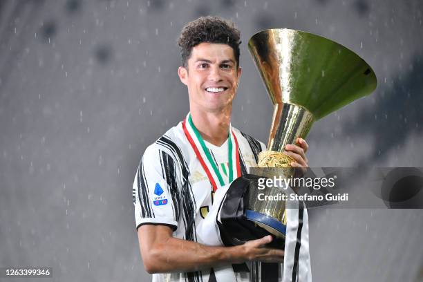 Cristiano Ronaldo of Juventus FC celebrates with the trophy after winning the Serie A Championship 2019-2020 during the Serie A match between...
