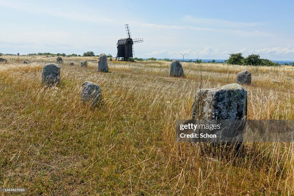 An old burial ground with a windmill on a sunny summer day
