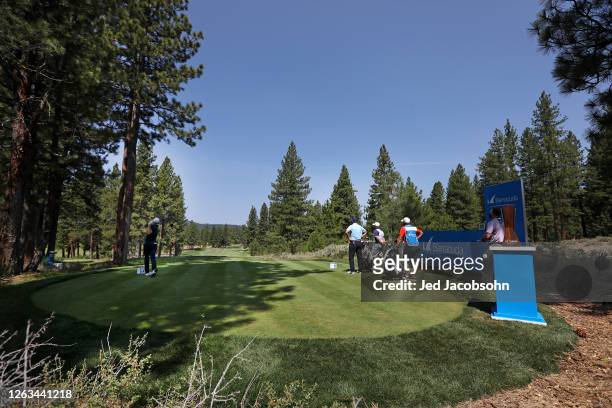 Wyndham Clark plays his shot from the first tee during the final round of the Barracuda Championship at Tahoe Mountain Club's Old Greenwood Golf...