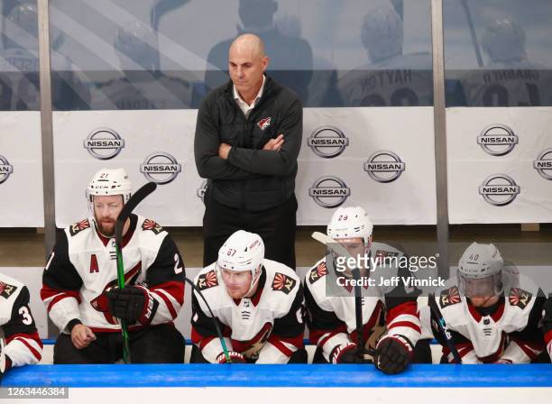 Head coach Rick Tocchet of the Arizona Coyotes handles bench duties during the game against the Nashville Predators in Game One of the Western...
