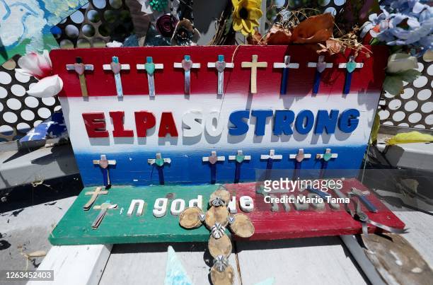 The words 'El Paso Strong' are written on a memento at a temporary memorial in Ponder Park honoring victims of the Walmart shooting which left 23...