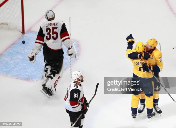 Filip Forsberg of the Nashville Predators celebrates his power-play goal at 8:56 of the third period along with Ryan Johansen against the Arizona...