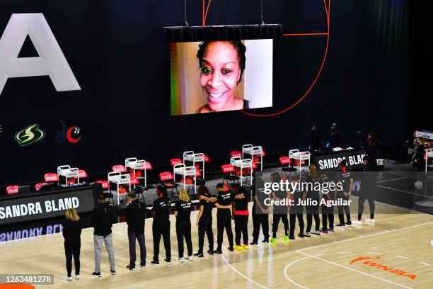 The Atlanta Dream observe a moment of silence for Sandra Bland before a game against the Indiana Fever at Feld Entertainment Center on August 02,...