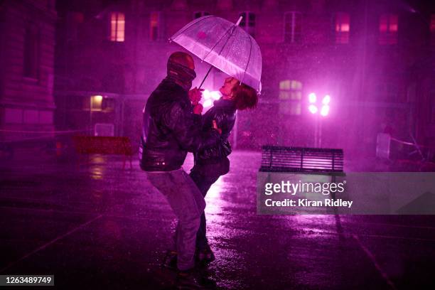 Visitors dance at the 'Purple Rain' installation at the Lycée Jacques-Decour on August 02, 2020 in Paris, France. Part of Festival Paris l'Eté, the...