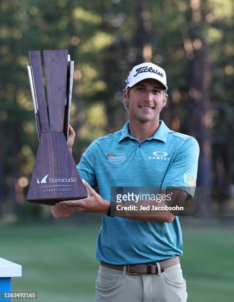 Richy Werenski poses with the trophy after putting in to win on the 18th green during the final round of the Barracuda Championship at Tahoe Mountain...