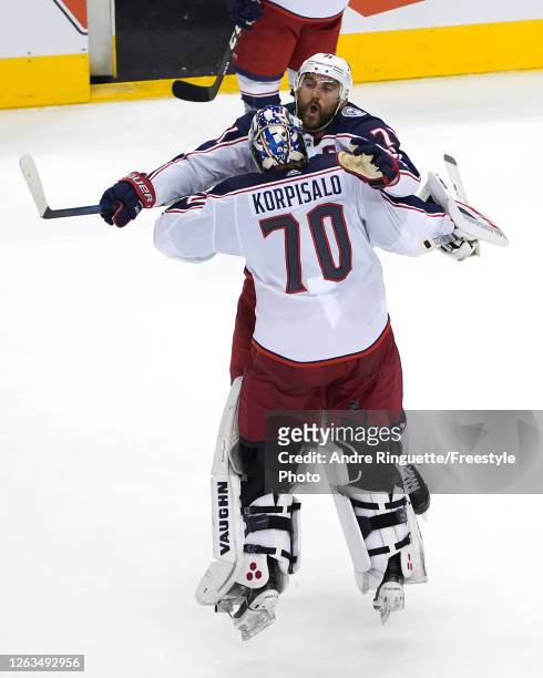 Nick Foligno of the Columbus Blue Jackets congratulates Joonas Korpisalo after he recorded the team's first shut out after defeating the Toronto...