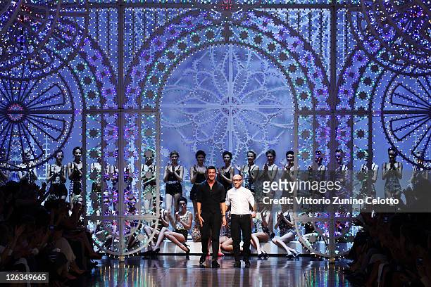 Designers Stefano Gabbana and Domenico Dolce acknowledge the audience at the Dolce & Gabbana Spring/Summer 2012 fashion show as part Milan Womenswear...