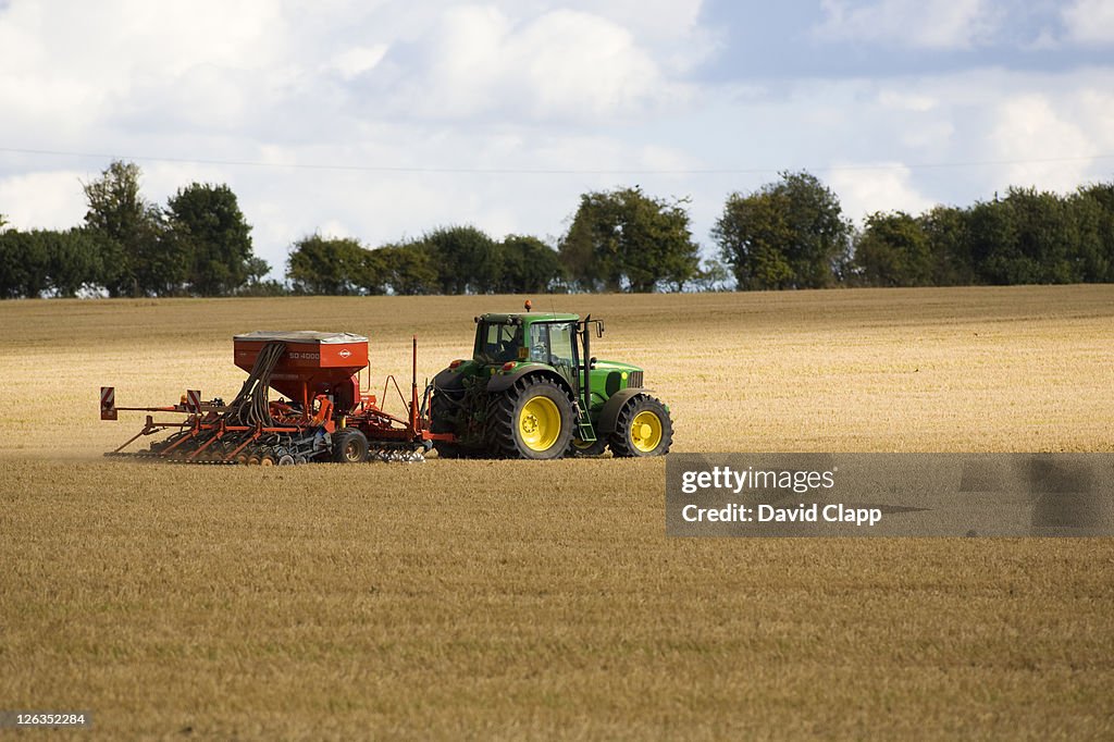 Tractor Raking Fields Tractor Raking An Open Field After A Recent Harvest In Wiltshire High ...