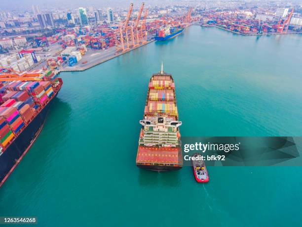 aerial view of cargo ship in transit. - portmiami stock pictures, royalty-free photos & images