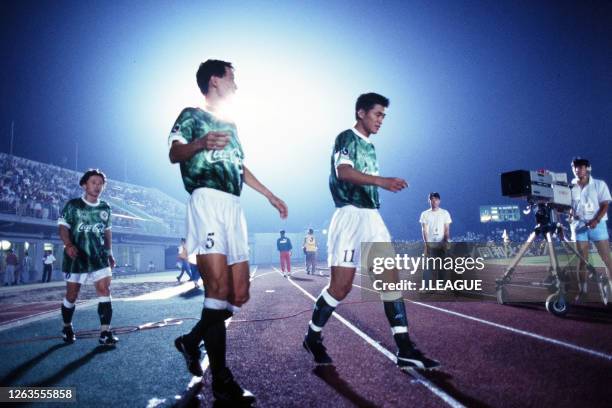 Kazuyoshi Miura and Tetsuji Hashiratani of Verdy Kawasaki walk into the pitch before the second half during the J.League Suntory Series match between...