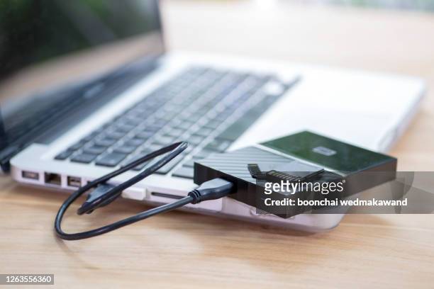 external hard drive and memory card - backup stock pictures, royalty-free photos & images