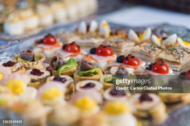 close-up of colorful canapes served on a plate - haute couture food concept stock pictures, royalty-free photos & images