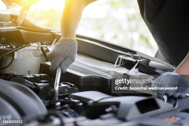 professional mechanic checking car engine. - auto mechanic shop stock pictures, royalty-free photos & images