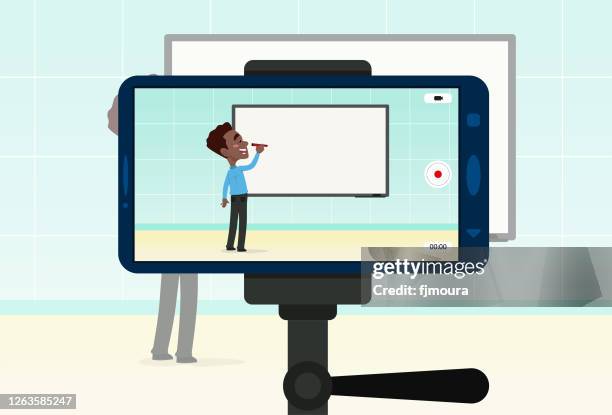 recording online class for your students - students using computers in classroom stock illustrations