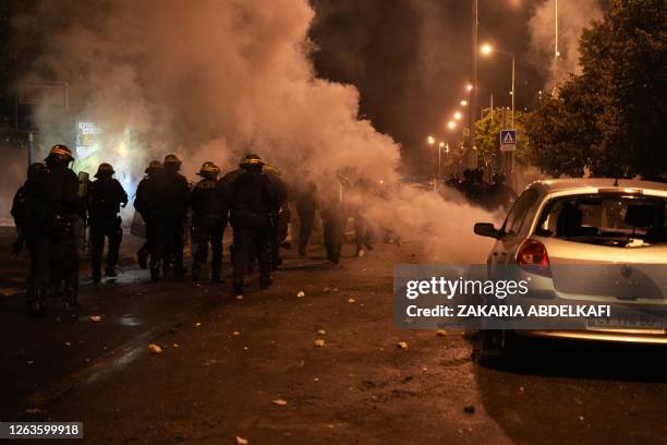 Riot police gather during protests in Nanterre, west of Paris, on June 28 a day after a 17-year-old boy was shot in the chest by police at...