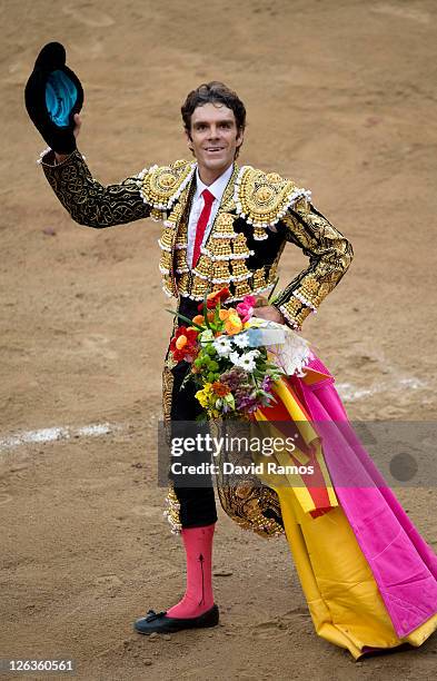Bullfighter Jose Tomas salutes the crowd after his performance during the last bullfight at the La Monumental on September 25, 2011 in Barcelona,...
