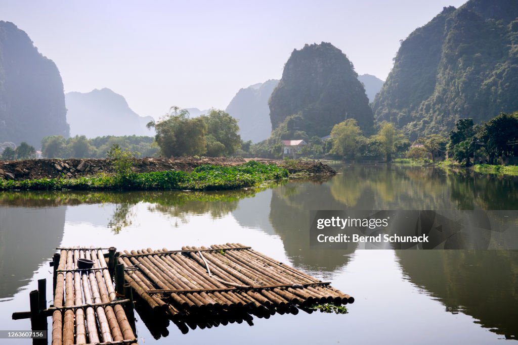 Jetty on a river between the karst rocks of Ninh Binh