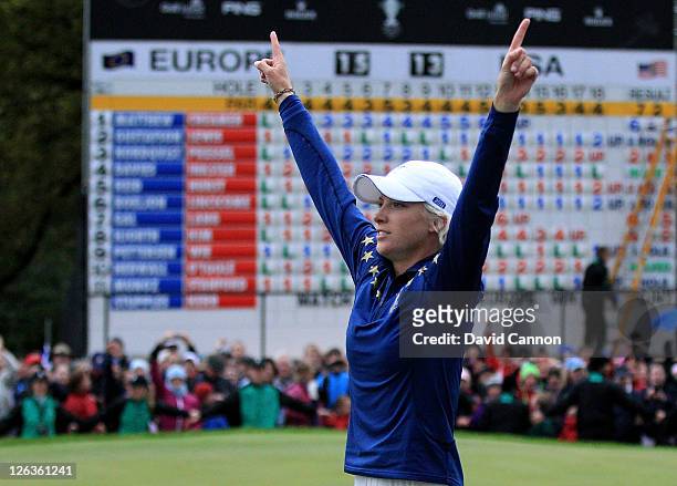 Melissa Reid of Europe celebrates her team's 15-13 victory on the 18th green during the singles matches on day three of the 2011 Solheim Cup at...