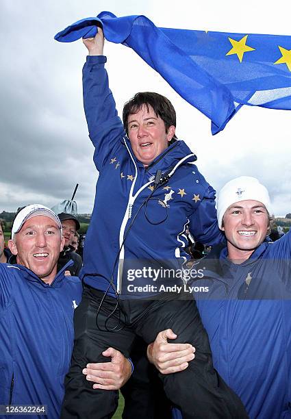 Europe Captain Alison Nicholas celebrates her team's 15-13 victory on the 18th green during the singles matches on day three of the 2011 Solheim Cup...