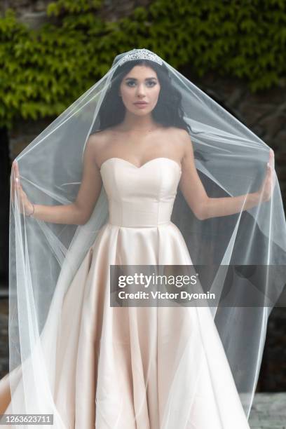 outdoor full length portrait of the charming bride - bride dress photos et images de collection