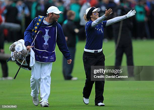 Azahara Munoz of Europe acknowledges the crowd on the 18th green during the singles matches on day three of the 2011 Solheim Cup at Killeen Castle...