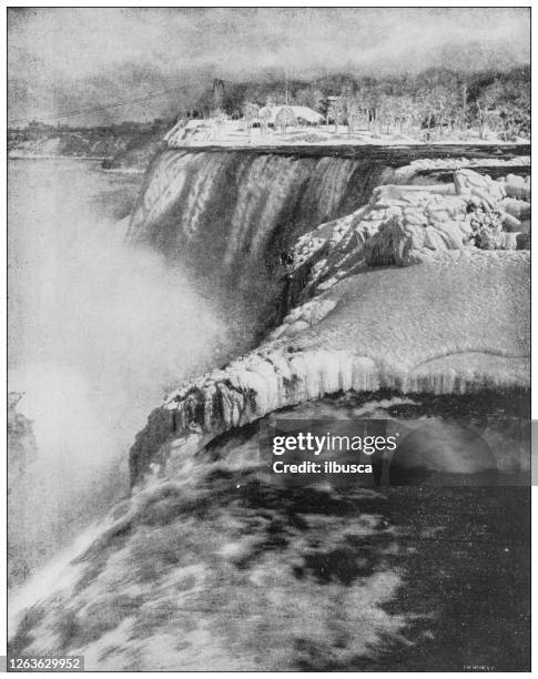 antique black and white photograph: niagara falls in winter - niagara falls city ontario stock illustrations