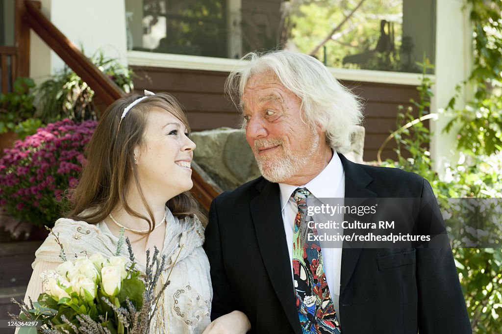 Bride walking with father