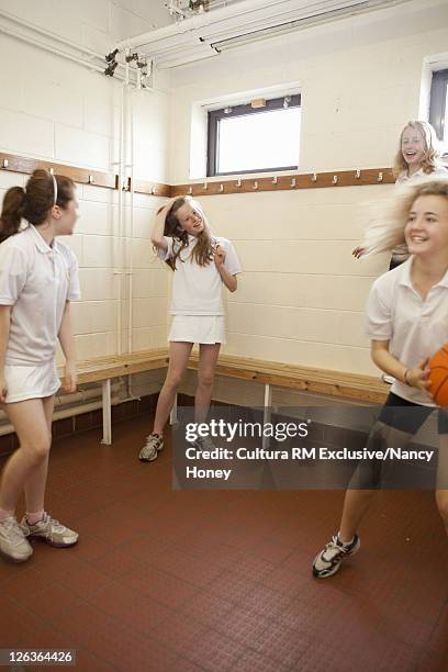 students talking in locker room - school locker room stock pictures, royalty-free photos & images