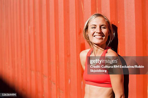 woman leaning on shipping container - refshaleøen stock pictures, royalty-free photos & images