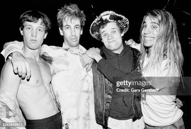 Portrait of the members of American Rock group Red Hot Chili Peppers as they pose together before a sold-out performance at the Ritz, New York, New...