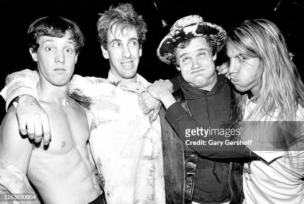 Portrait of the members of American Rock group Red Hot Chili Peppers as they pose together before a sold-out performance at the Ritz, New York, New...