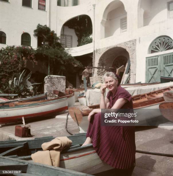 English actress and singer Gracie Fields posed at La Canzone del Mare on the Isle of Capri, Italy in October 1952.