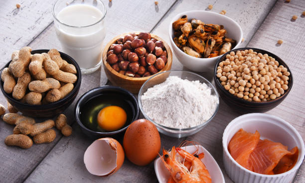 composition with common food allergens - food allergy stock pictures which include shellfish, peanuts, flour, milk, soybeans and others