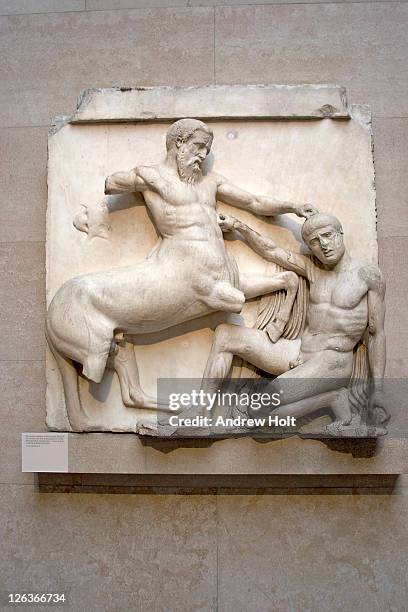 a close up detail of a centaur and lapith, taken  from the south metope of the parthenon sculptures, more commonly known as the 'elgin marbles'. the elgin marbles, a subset of parthenon marbles, are a large collection of marble sculptures removed from athe - elgin marbles stock pictures, royalty-free photos & images