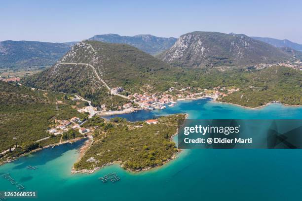 aerial view of the medieval town of mali ston in the peljeac peninsula in croatia - ston croatia stock pictures, royalty-free photos & images