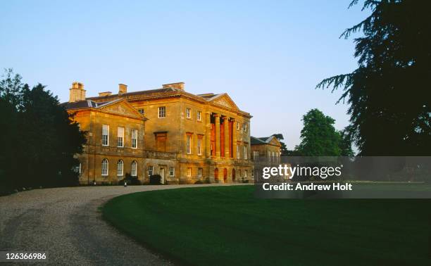 the sun sets over basildon park, located in the berkshire countryside. the masterpiece of john carr of york, this palladian villa was built for sir francis sykes between 1776 and 1783. it is a beautifully balanced building of warm bath stone consisting of  - andrea park stock pictures, royalty-free photos & images