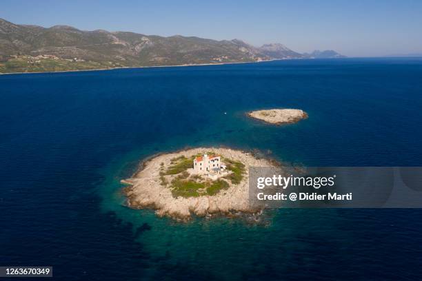 lighthouse on a tiny island off the coast of the pelješac peninsula by the adriatic sea in croatia - house remote location stock pictures, royalty-free photos & images