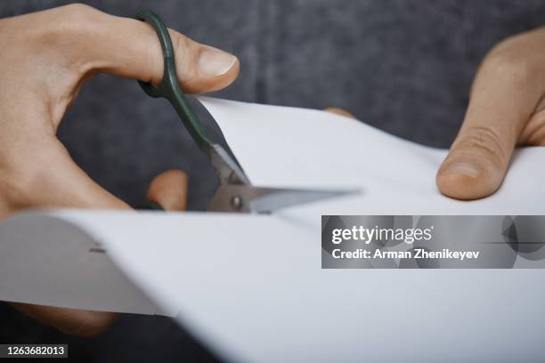 Someone Using Scissors Hand Paper Cut Photos and Premium High Res Pictures - Getty Images