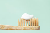Bamboo toothbrush with toothpaste.