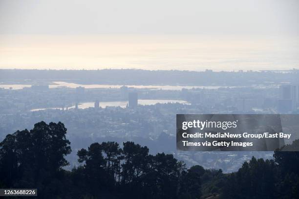 The view of Oakland, Calif., photographed from atop Grizzly Peak Boulevard, as smoke from Butte County's Camp Fire wildfire drifts into the Bay Area...