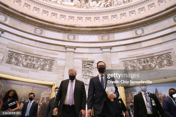 Wearing a face mask to reduce the risk of coronavirus, Treasury Secretary Steven Mnuchin and White House Chief of Staff Mark Meadows walk through the...